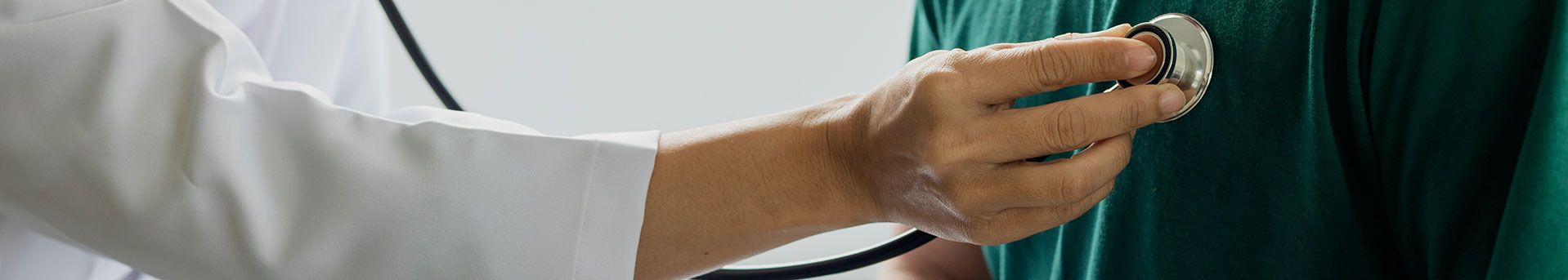 primary care doctor doing an exam with a stethoscope